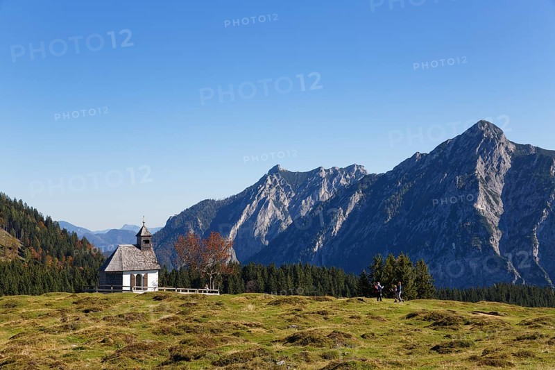 Chapel on Postalm alpine pasture with Rinnkogel Mountain