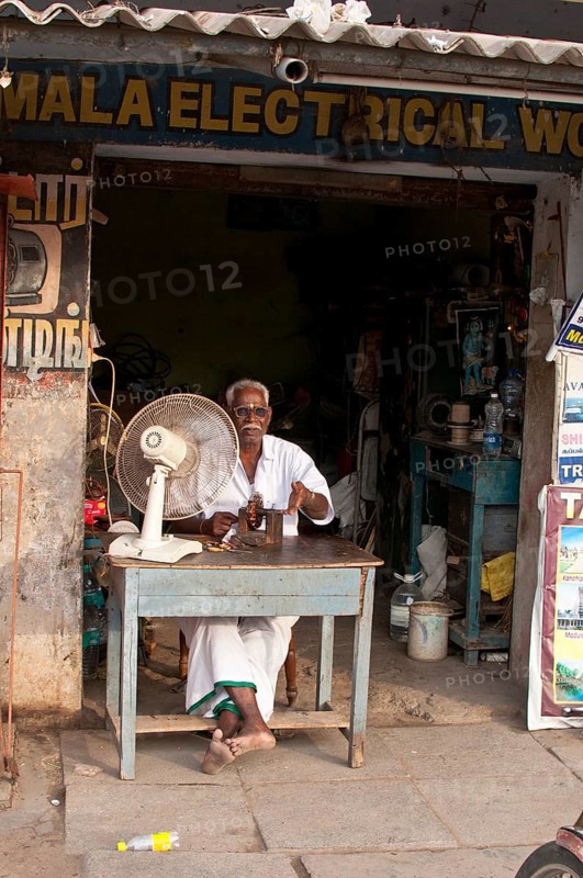 Electrician in front of his business