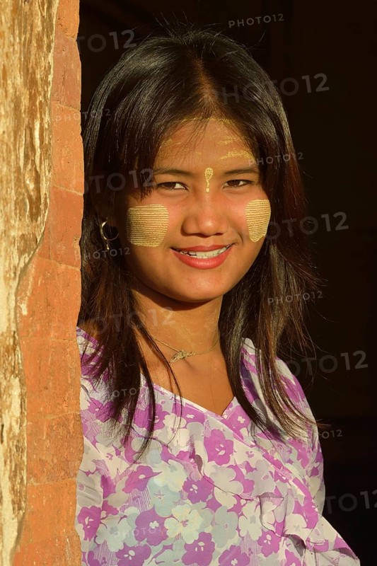 Girl with thanaka paste on her face