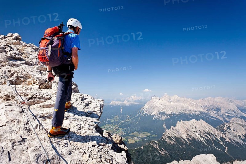 Mountain climber ascending the Via Ferrata Marino Bianchi climbing route on Monte Cristallo