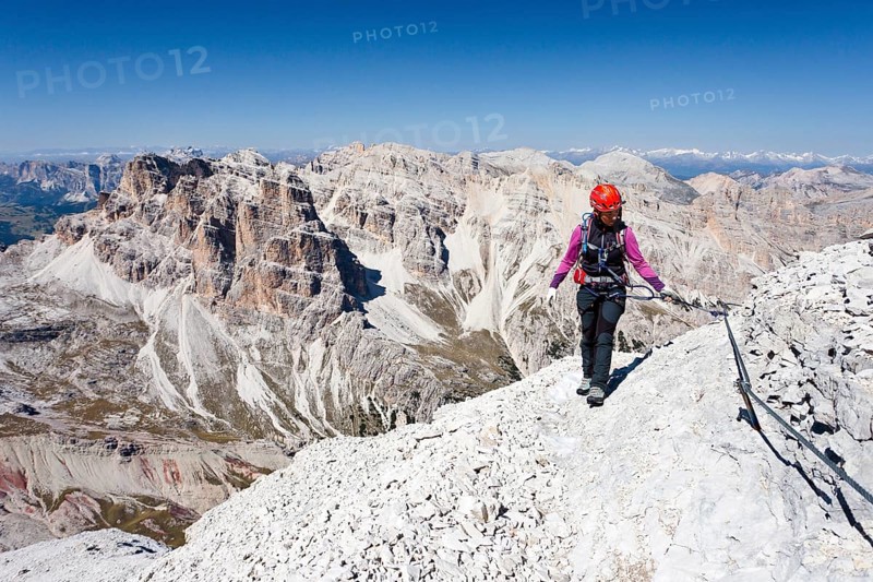 Mountain climber ascending Tofane di Rozes Mountain along the Via Ferrata Giovanni Lipella climbing route