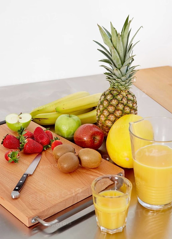Various types of fruit on a cutting board