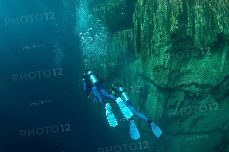 Scuba divers in Barracuda Lake