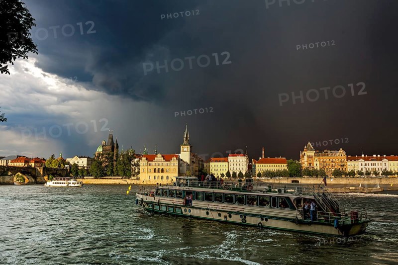 View over the Vltava river towards a thunderstorm