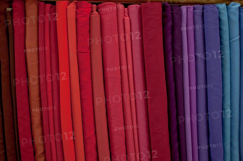 Fabrics lined up on a rack