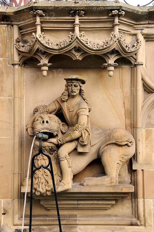 High relief of Samson with the Lion as a well figure on the Gothic Fischbrunnen fountain