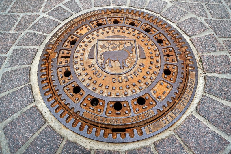 Manhole cover with the bull
