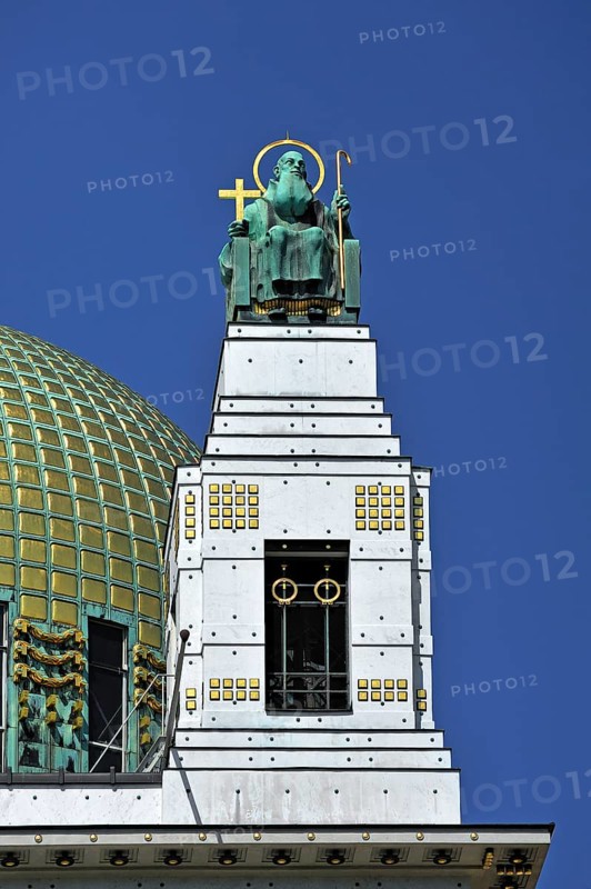 Statue of the preacher Severin beside the dome of the Church of St. Leopold at Steinhof Psychiatric Hospital