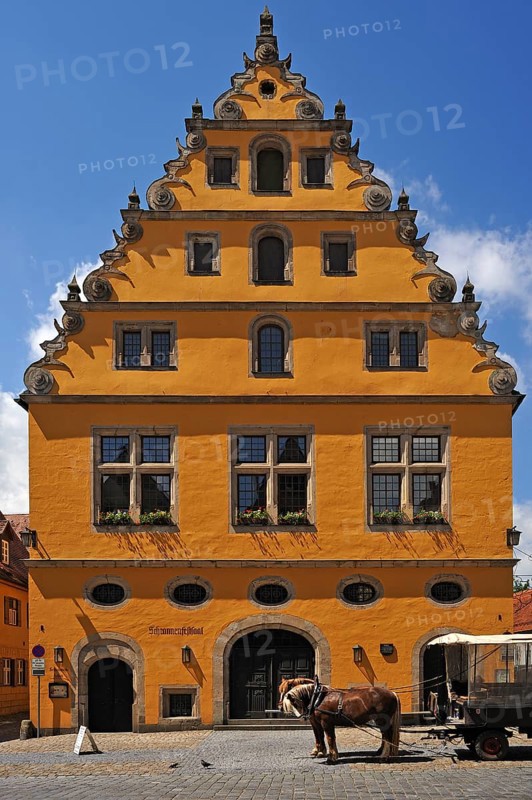 Former municipal granary with a steep pitched roof and Baroque voluted gable