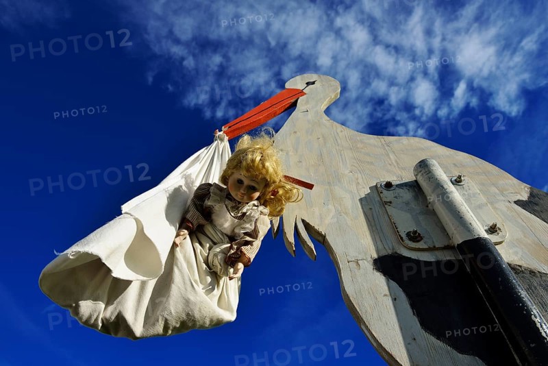 Stork bringing a baby