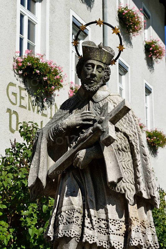 Statue of a bridge saint in front parish town hall