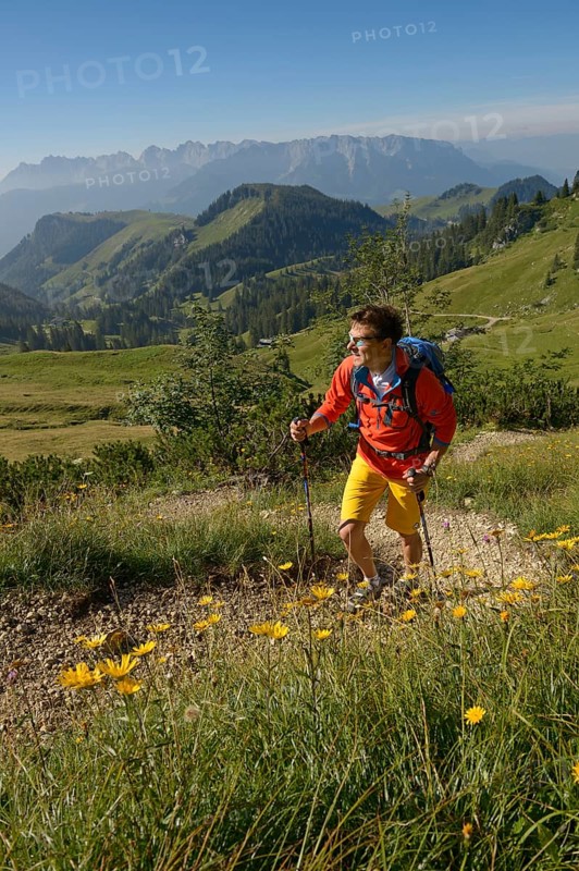 Hiker ascending Geigelstein Mountain