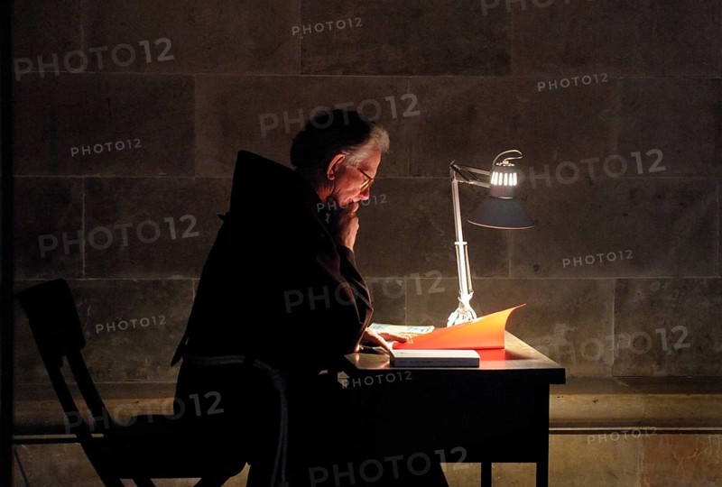 Cleric studying books