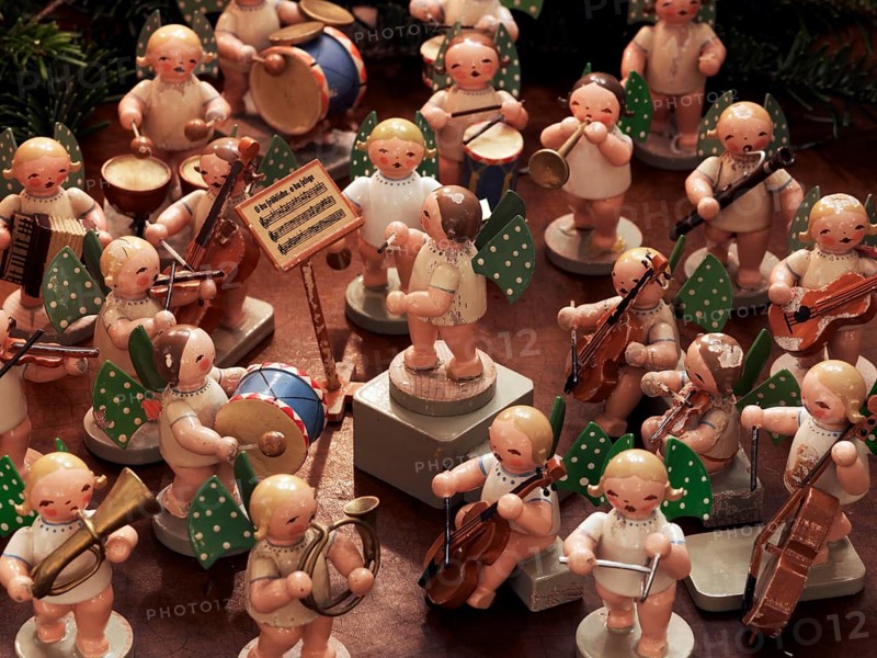 Handmade wooden angels playing musical instruments as a table decoration from the Erzgebirge or Ore Mountains