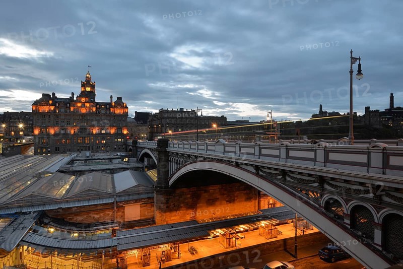 Views of the old town illuminated in the evening with the tower of the Balmoral Hotel