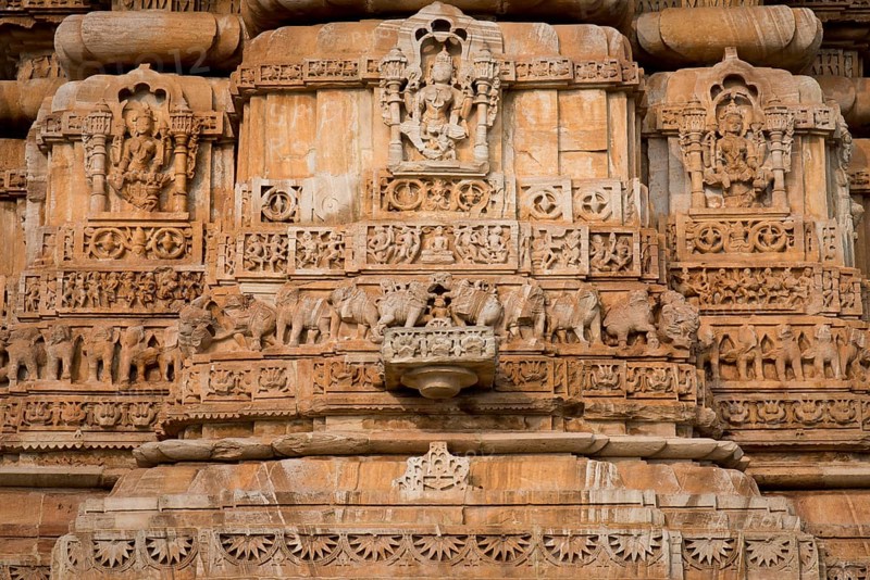 Decorative sculptures on the base of Kirti Stambha