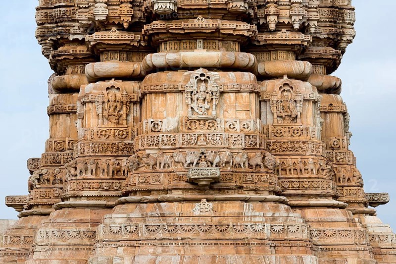 Decorative sculptures on the base of Kirti Stambha