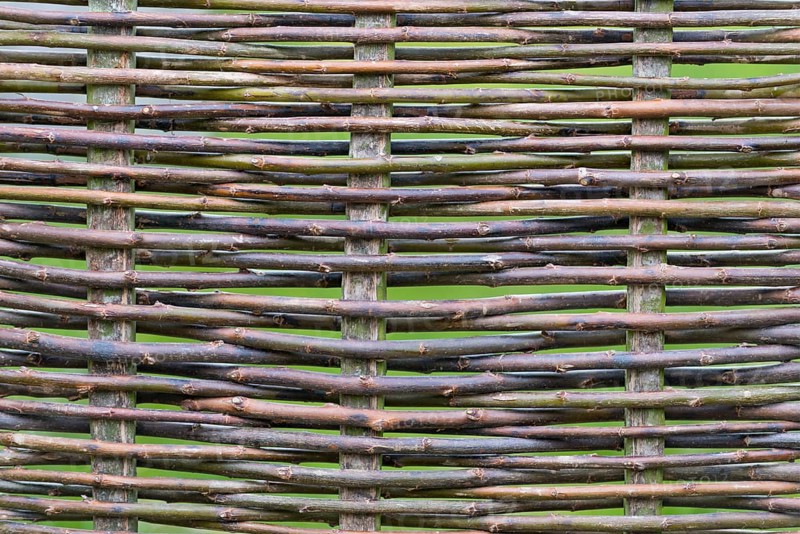 Woven fence made from hazel rods