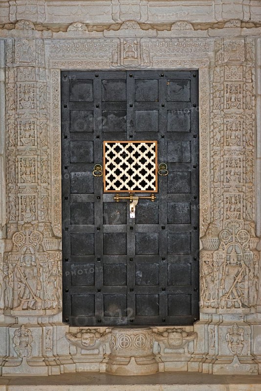 Iron door framed by ornate columns