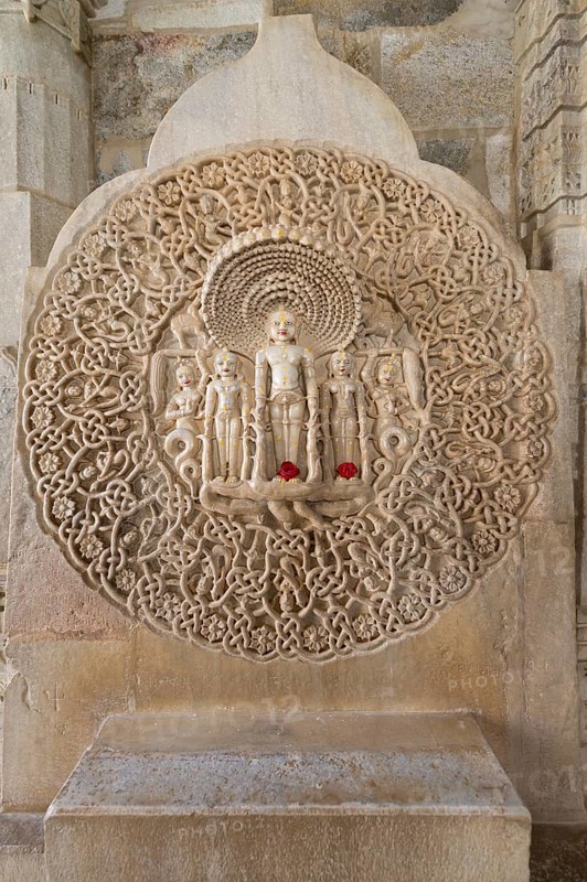 Tirthankar Parshvanat in the medallion protected by the thousand-headed serpent God Dharanendra against a powerful storm