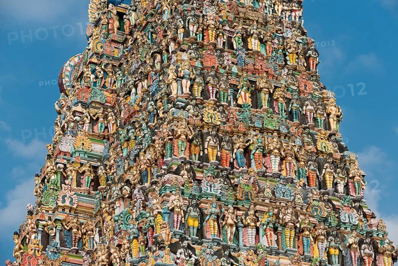 Colourful statues of gods and demons on the Gopuram or Gopura gate tower