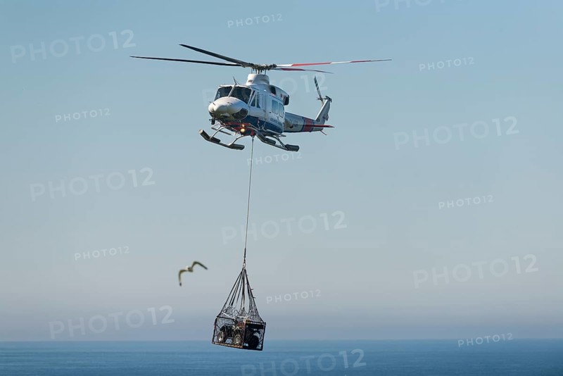 Atlantic Airways helicopter transporting a quad bike
