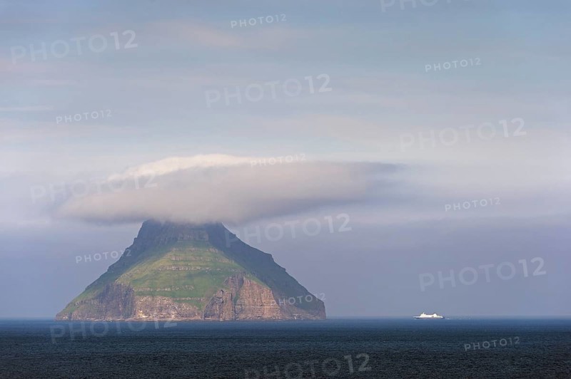 The only uninhabited island of the Faroe Islands with a ferry of the Smyril Line travelling in the Suouroyarfjorour Strait