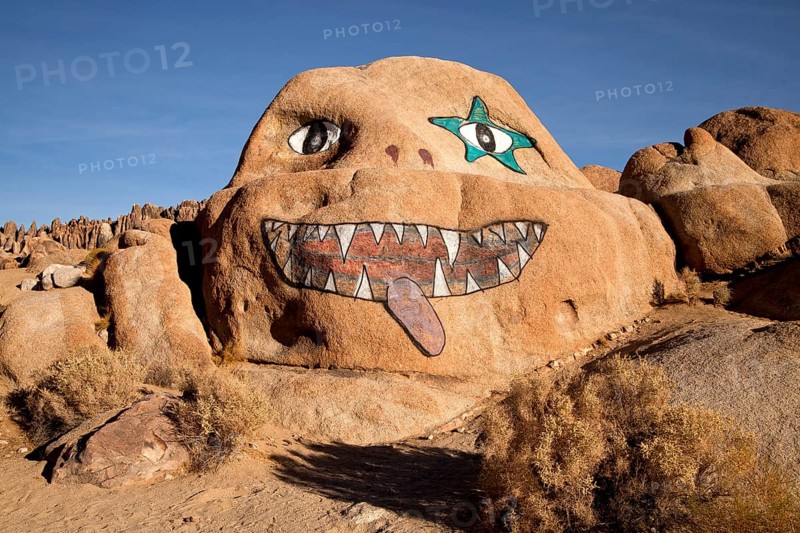 Face painted on a rock