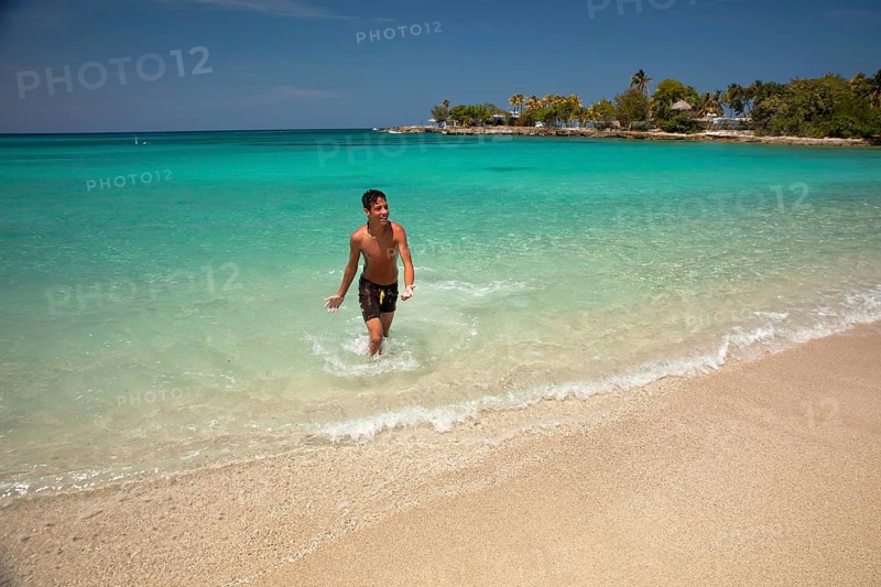 Young Cuban man on Playa Bacuranao beach