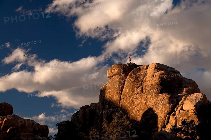 Climber on top of a rock