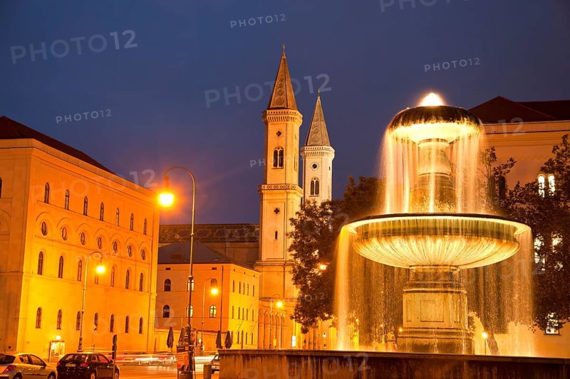 Illuminated fountain of the University and the Church of St. Louis