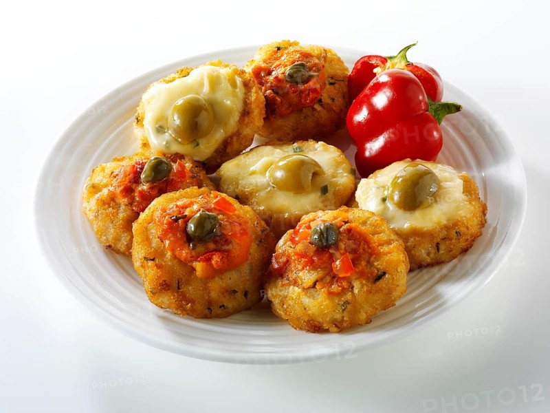 Mini potato rosti topped with tomato salsa