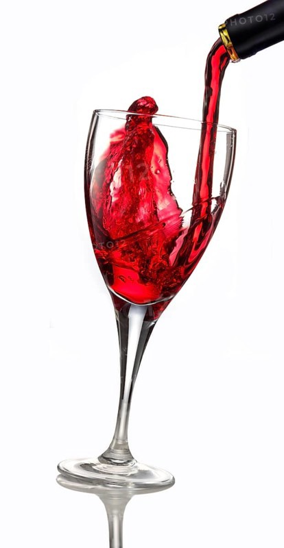 Red wine being poured into a glass