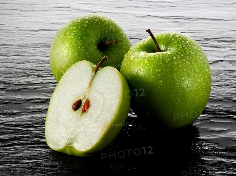 Whole and cut Granny Smith apples