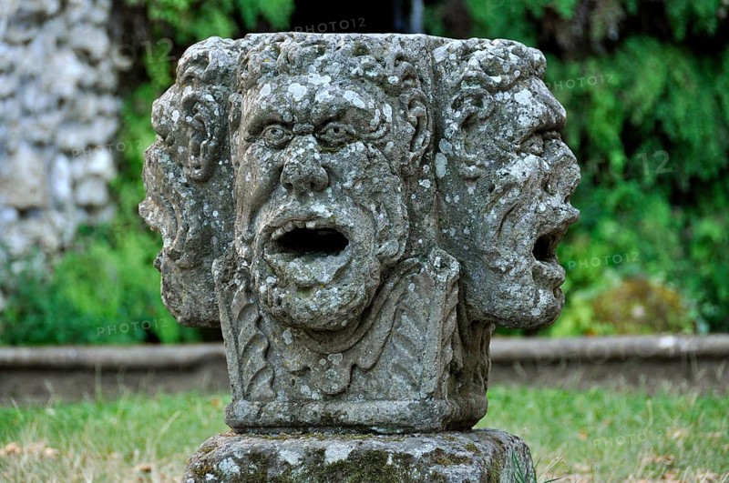 Stone mask with four heads at the grotto of the water source