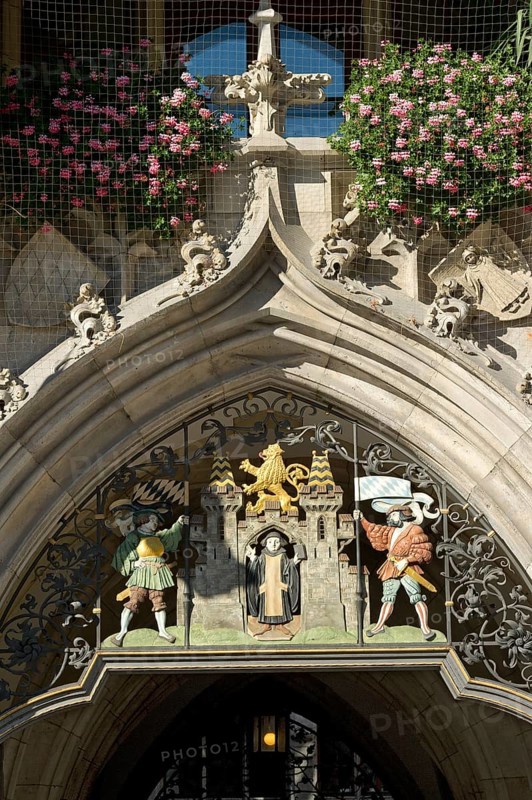 Wrought iron grille with the Muenchner Kindl at the entrance gate
