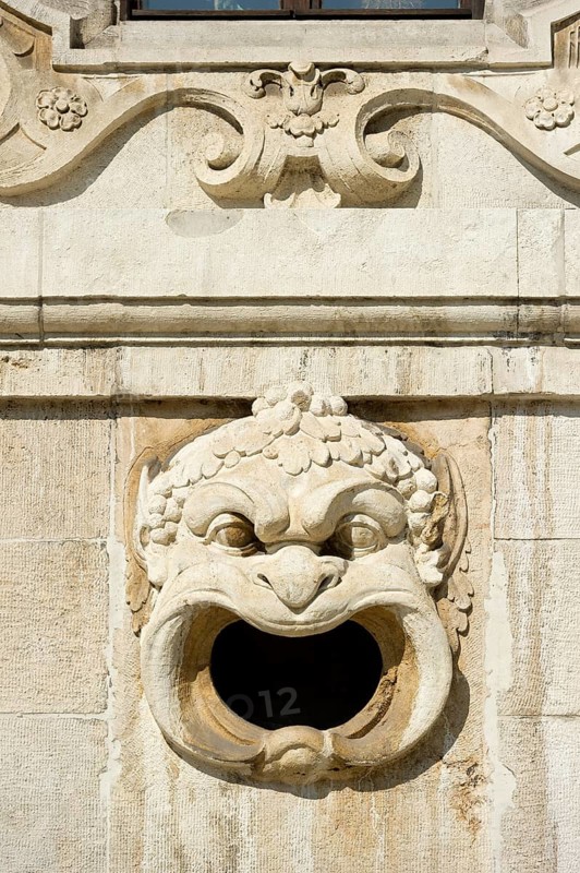 Decorative gargoyle on the outer wall of the Bavarian National Museum