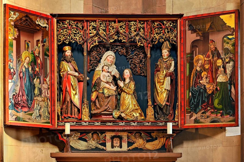 Carved altar dedicated to St Anne with the Anna selbdritt group between two saints