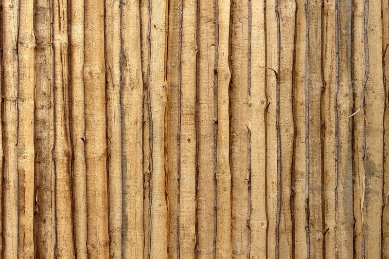 Wooden wall from untreated rough boards