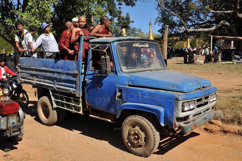 Buddhist monks and villagers on the way home from the Full Moon Festival in December