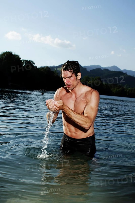Man standing in a lake in Sonthofen
