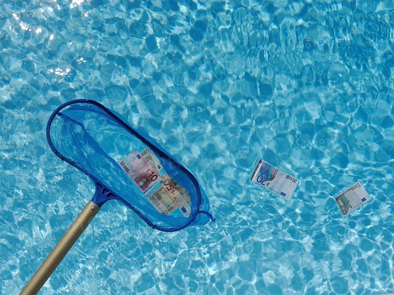 Dip net fishing Euro banknotes out of the water