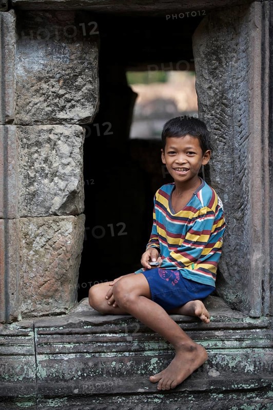 Boy in the temple complex of Preah Khan or Prah Khan