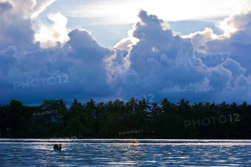 Boys in a canoe in the Marovo Lagoon