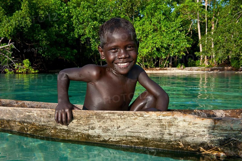 Local boy in a canoe in the Marovo Lagoon
