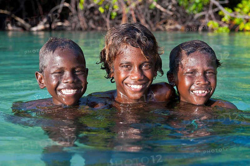 Local boys in the water of the Marovo Lagoon