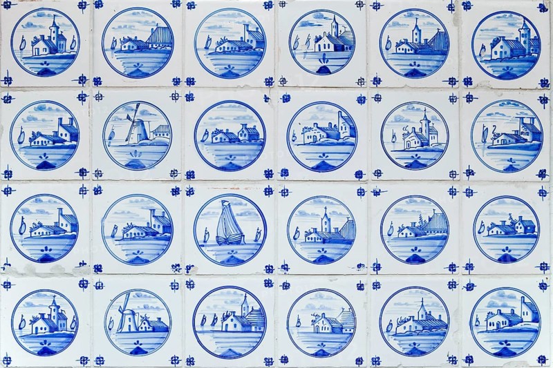 Old hand-painted Delftware tiles in a heated women's room in the only house on Suederoog Hallig