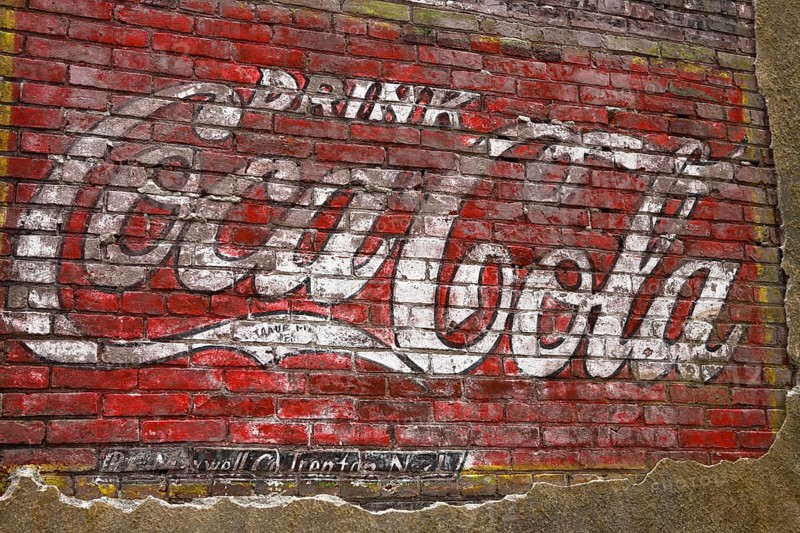 Old Coca-Cola advertising on a brick wall