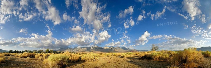 Desert landscape with a cloudy sky in the morning at the foot of the Sierra Nevada mountains