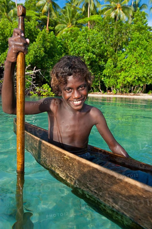 Local boy in a canoe in the Marovo Lagoon